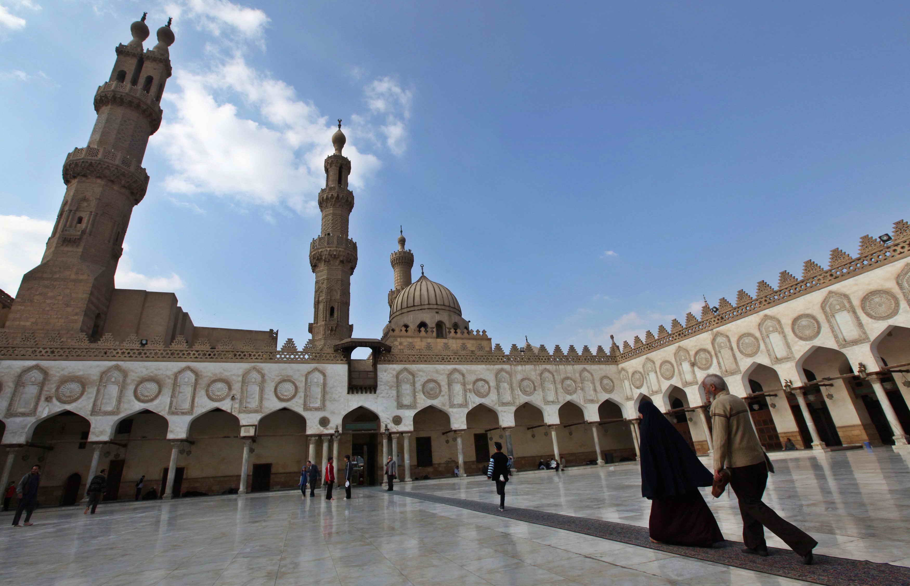 Muslim walk at Al Azhar mosque in the old city of Cairo December 2, 2011. The Muslim Brotherhood's party and its ultra-conservative Salafi rivals looked set to top the polls in Egypt's election, to the alarm of many at home and abroad. Moderate Islamists have won elections in Tunisia and Morocco in the past two months. REUTERS/Amr Abdallah Dalsh (EGYPT - Tags: POLITICS ELECTIONS RELIGION)